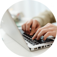 Photo of hands on a laptop keyboard